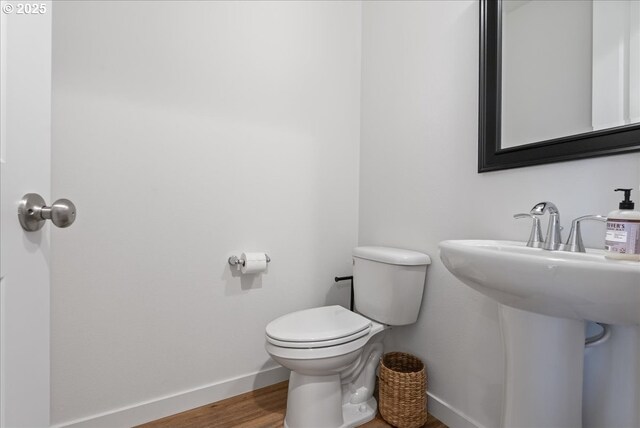 16615 SE Sunshower Pl, Happy Valley, OR 97086 - bathroom featuring baseboards, toilet, and wood finished floors