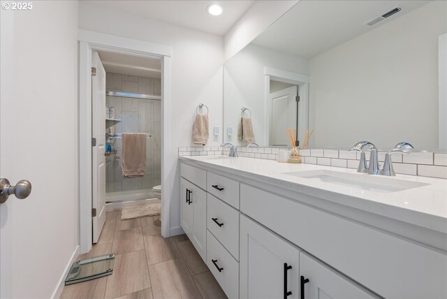 16615 SE Sunshower Pl, Happy Valley, OR 97086 - bathroom with toilet, double vanity, a stall shower, and recessed lighting