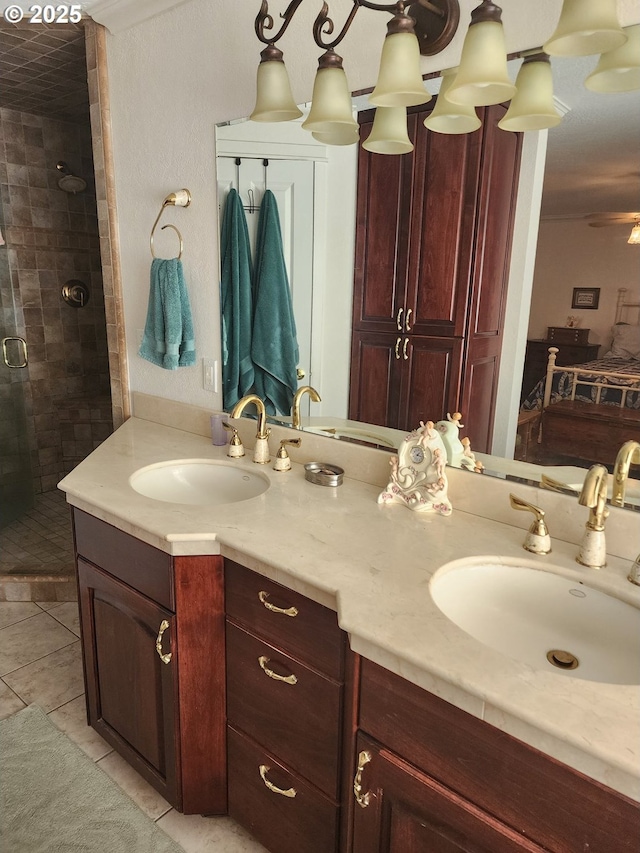 full bathroom with vanity, a shower stall, and tile patterned flooring