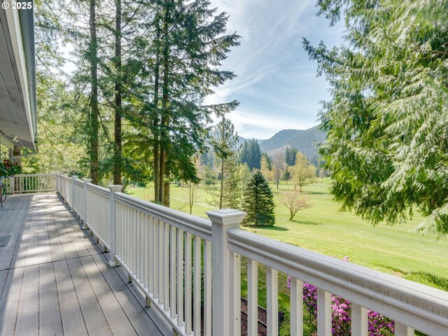 69070 E Fairway Ave, Welches, OR 97067 - deck featuring a mountain view and a lawn
