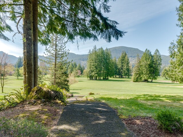 69070 E Fairway Ave, Welches, OR 97067 - view of home's community with a mountain view and a yard