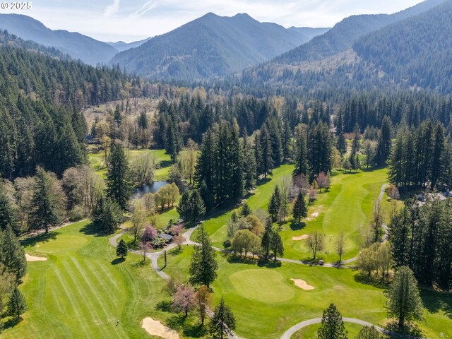 69070 E Fairway Ave, Welches, OR 97067 - aerial view of a heavily wooded area, a golf course, and a water and mountain view