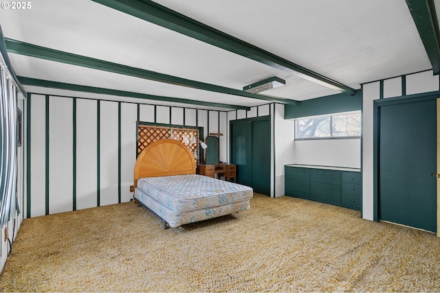 bedroom with carpet and beamed ceiling