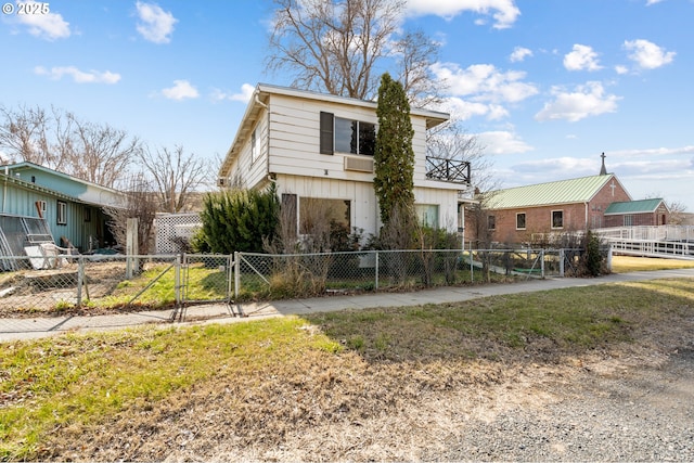 view of front of house featuring fence private yard and a gate