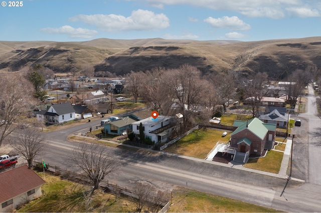 birds eye view of property with a residential view and a mountain view