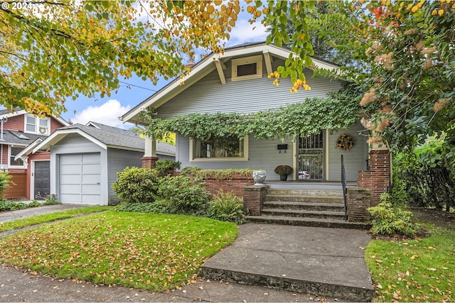 bungalow-style house featuring covered porch, a garage, and a front yard