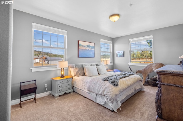 bedroom featuring light carpet