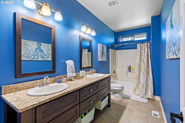 full bathroom with dual sinks, toilet, shower / bath combo, large vanity, and tile floors