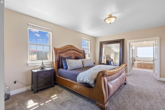 bedroom featuring carpet and ensuite bathroom