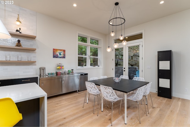 dining space with light hardwood / wood-style flooring