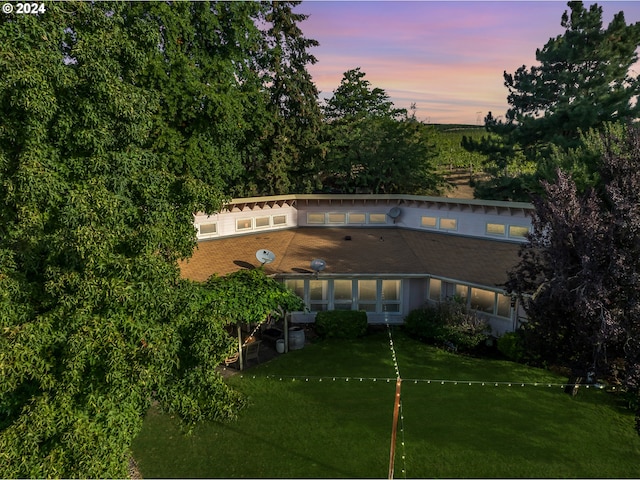 view of outdoor building at dusk