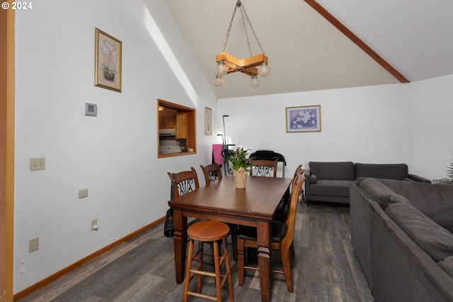 dining space with dark wood-type flooring and high vaulted ceiling