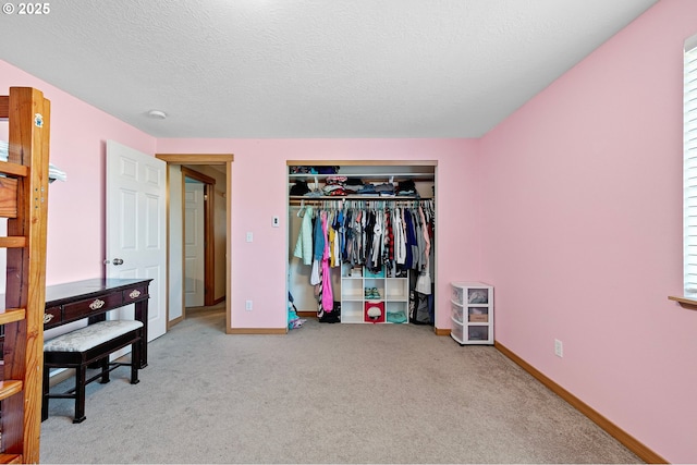 1062 Applegate Pl, Harrisburg, OR 97446 - bedroom with carpet, a closet, baseboards, and a textured ceiling