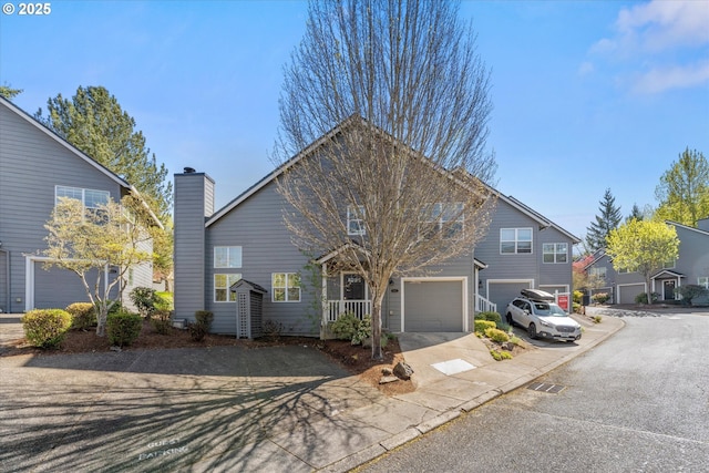 traditional-style home with a garage and concrete driveway
