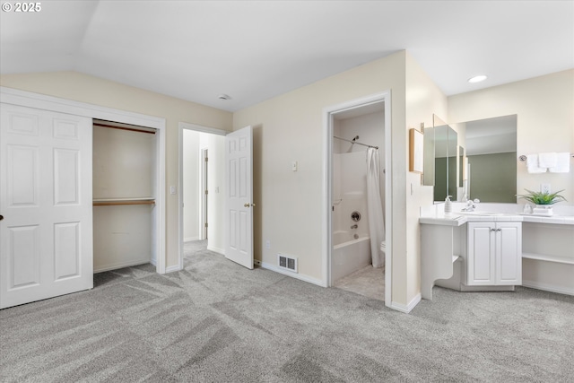unfurnished bedroom featuring a sink, ensuite bathroom, visible vents, baseboards, and carpet floors