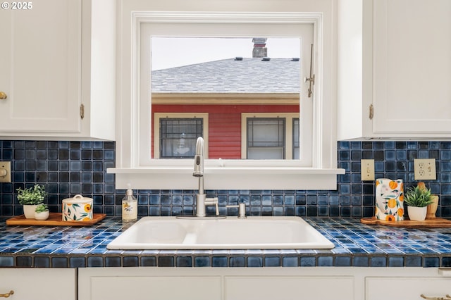 1403 SE Birch St, Portland, OR 97214 - kitchen with white cabinets, decorative backsplash, and tile countertops