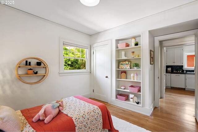 1403 SE Birch St, Portland, OR 97214 - bedroom featuring light wood-type flooring and baseboards
