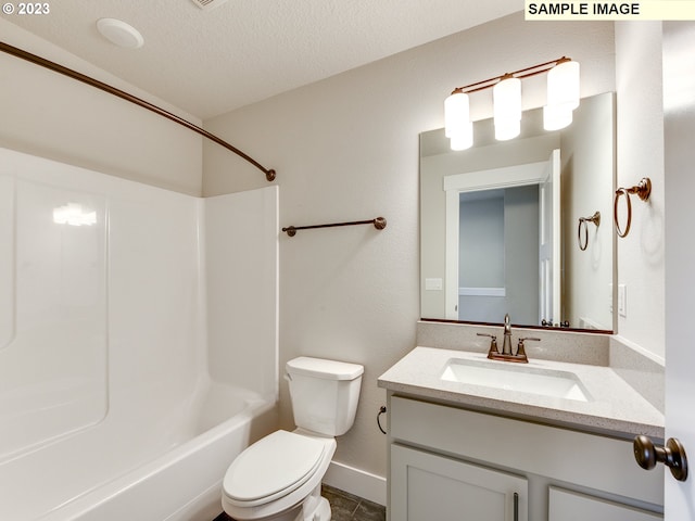 full bathroom featuring toilet, shower / bath combination, vanity with extensive cabinet space, tile floors, and a textured ceiling