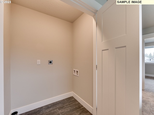 clothes washing area with washer hookup, electric dryer hookup, and dark carpet