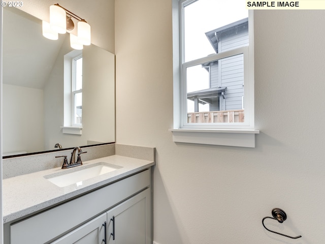 bathroom featuring vanity with extensive cabinet space