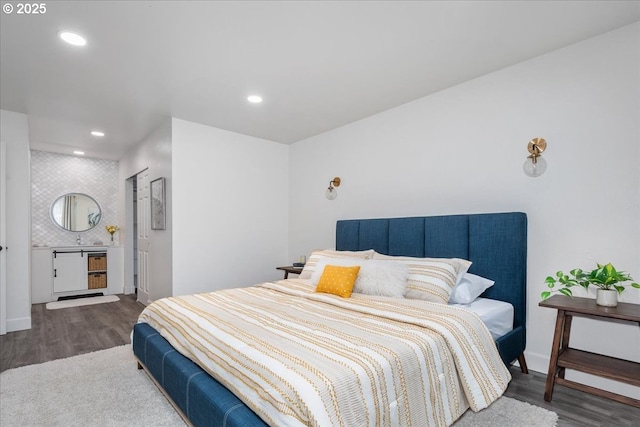 bedroom with recessed lighting, baseboards, and wood finished floors