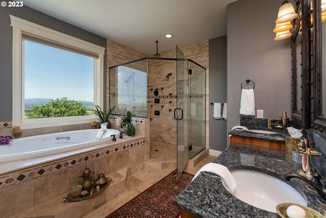 bathroom with tile floors, double vanity, and separate shower and tub