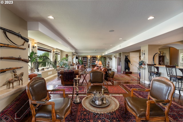 living room with a textured ceiling