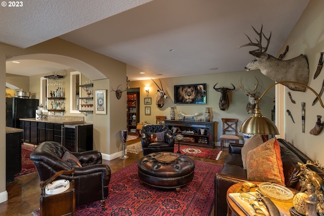 living room with a textured ceiling