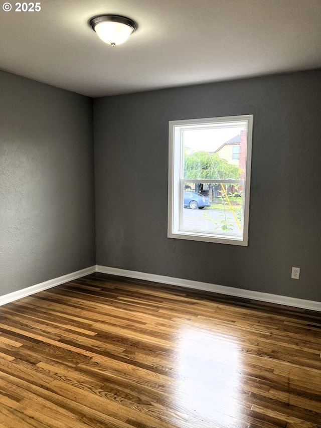 703 Cowlitz Way, Kelso, WA 98626 - unfurnished room with dark wood-style floors and baseboards