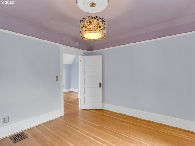 unfurnished room featuring light hardwood / wood-style floors