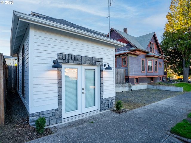 rear view of house with a patio area and french doors