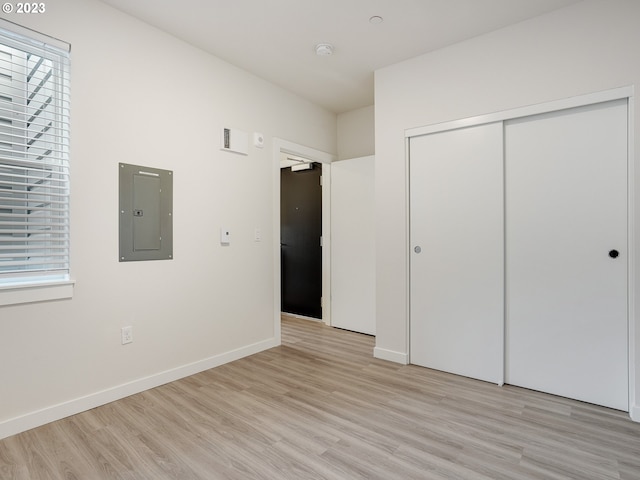 4738 SE Belmont St, Portland, OR 97215 - unfurnished bedroom with a closet, light hardwood / wood-style floors, and multiple windows