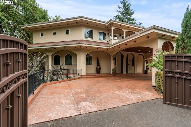 mediterranean / spanish-style house featuring a patio