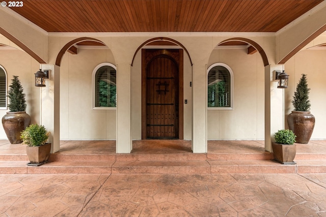 entrance to property featuring a patio