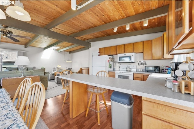 kitchen with white appliances, light countertops, a peninsula, wood finished floors, and a ceiling fan