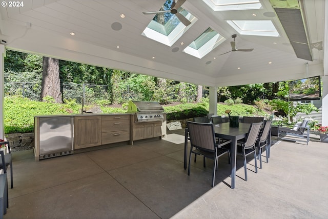 view of patio / terrace with area for grilling, outdoor dining space, a ceiling fan, and fence