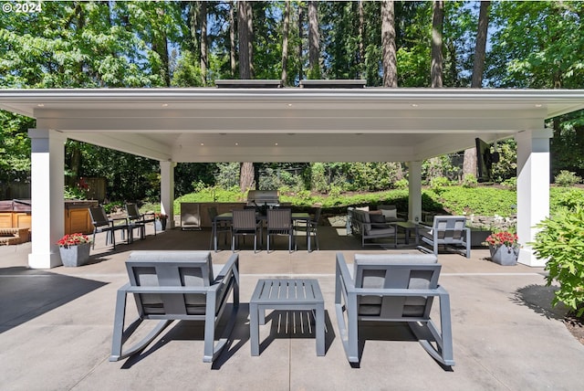 view of patio featuring a gazebo, an outdoor living space, outdoor dining space, and grilling area