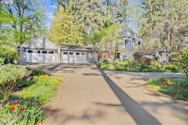 view of front of home with a garage and driveway