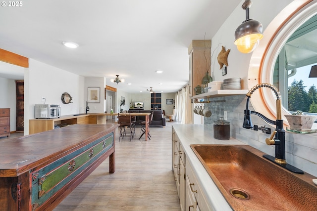 53310 Morrison Rd, Bandon, OR 97411 - kitchen with light wood-type flooring, white cabinets, recessed lighting, open floor plan, and backsplash
