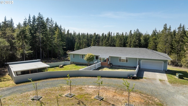 53310 Morrison Rd, Bandon, OR 97411 - ranch-style house featuring driveway, a view of trees, and a garage