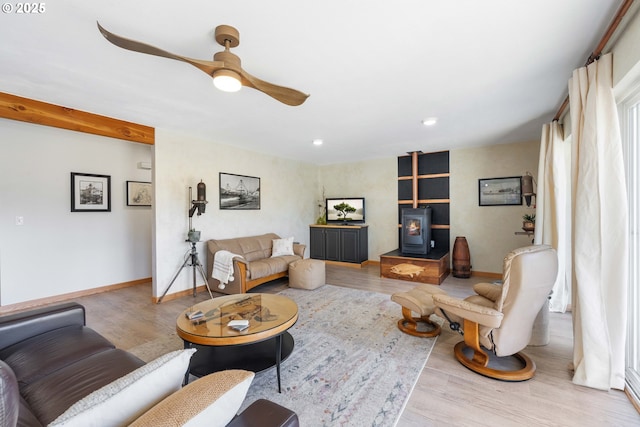53310 Morrison Rd, Bandon, OR 97411 - living room with a wood stove, wood finished floors, ceiling fan, and recessed lighting