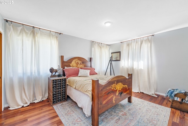 53310 Morrison Rd, Bandon, OR 97411 - bedroom with multiple windows and wood finished floors