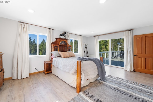 53310 Morrison Rd, Bandon, OR 97411 - bedroom featuring access to exterior, multiple windows, light wood finished floors, and recessed lighting