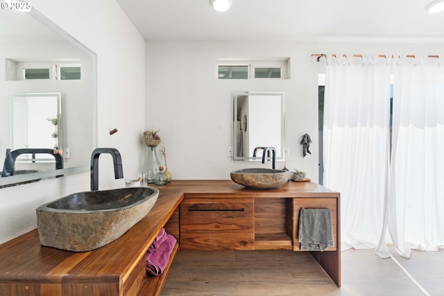 53310 Morrison Rd, Bandon, OR 97411 - full bathroom featuring double vanity and wood finished floors