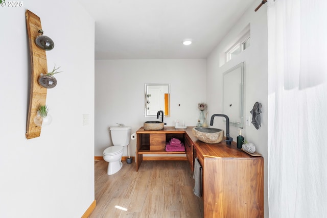 53310 Morrison Rd, Bandon, OR 97411 - full bathroom with double vanity and wood finished floors