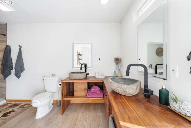 53310 Morrison Rd, Bandon, OR 97411 - full bathroom featuring wood finished floors and double vanity