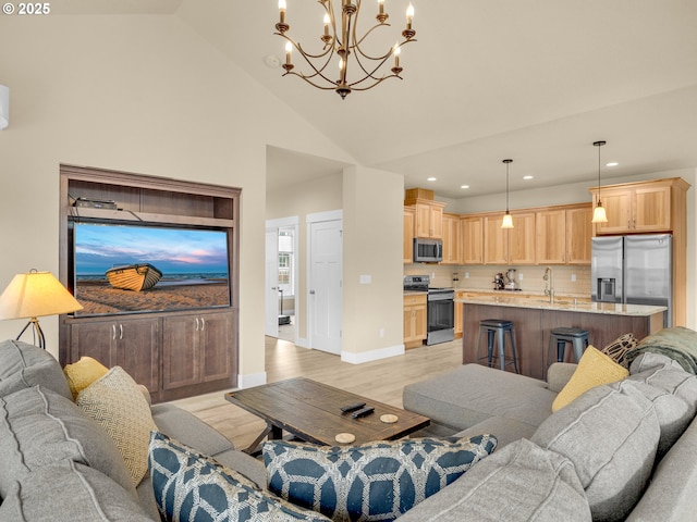 293 W Kershul Cir, Gearhart, OR 97138 - living room with a chandelier, light wood-style flooring, recessed lighting, and high vaulted ceiling