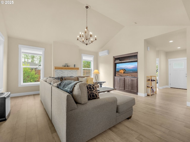 293 W Kershul Cir, Gearhart, OR 97138 - living area with light wood-type flooring, a chandelier, a wall unit AC, recessed lighting, and high vaulted ceiling