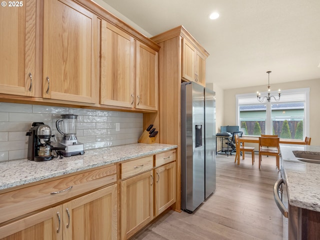 293 W Kershul Cir, Gearhart, OR 97138 - kitchen featuring stainless steel refrigerator with ice dispenser, light brown cabinets, light wood-type flooring, tasteful backsplash, and recessed lighting