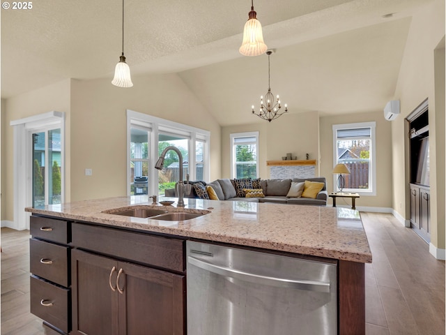 293 W Kershul Cir, Gearhart, OR 97138 - kitchen with stainless steel dishwasher, open floor plan, wood finished floors, decorative light fixtures, and lofted ceiling
